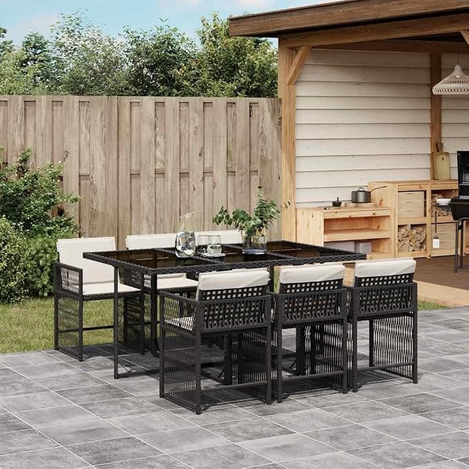 7-Piece Black PE Rattan Patio Dining Set with Cushions | Includes 6 chairs and 1 table in a space-saving cube design with cream white cushions for backyard and deck dining.