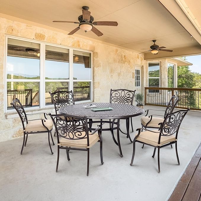 Hanover Traditions 7-Piece Outdoor Dining Set in Tan with Six Dining Chairs, Cushions and a 60 In. Round Cast-top Table, UV and Weather-Resistant, All-Weather Patio Dining Set for 6